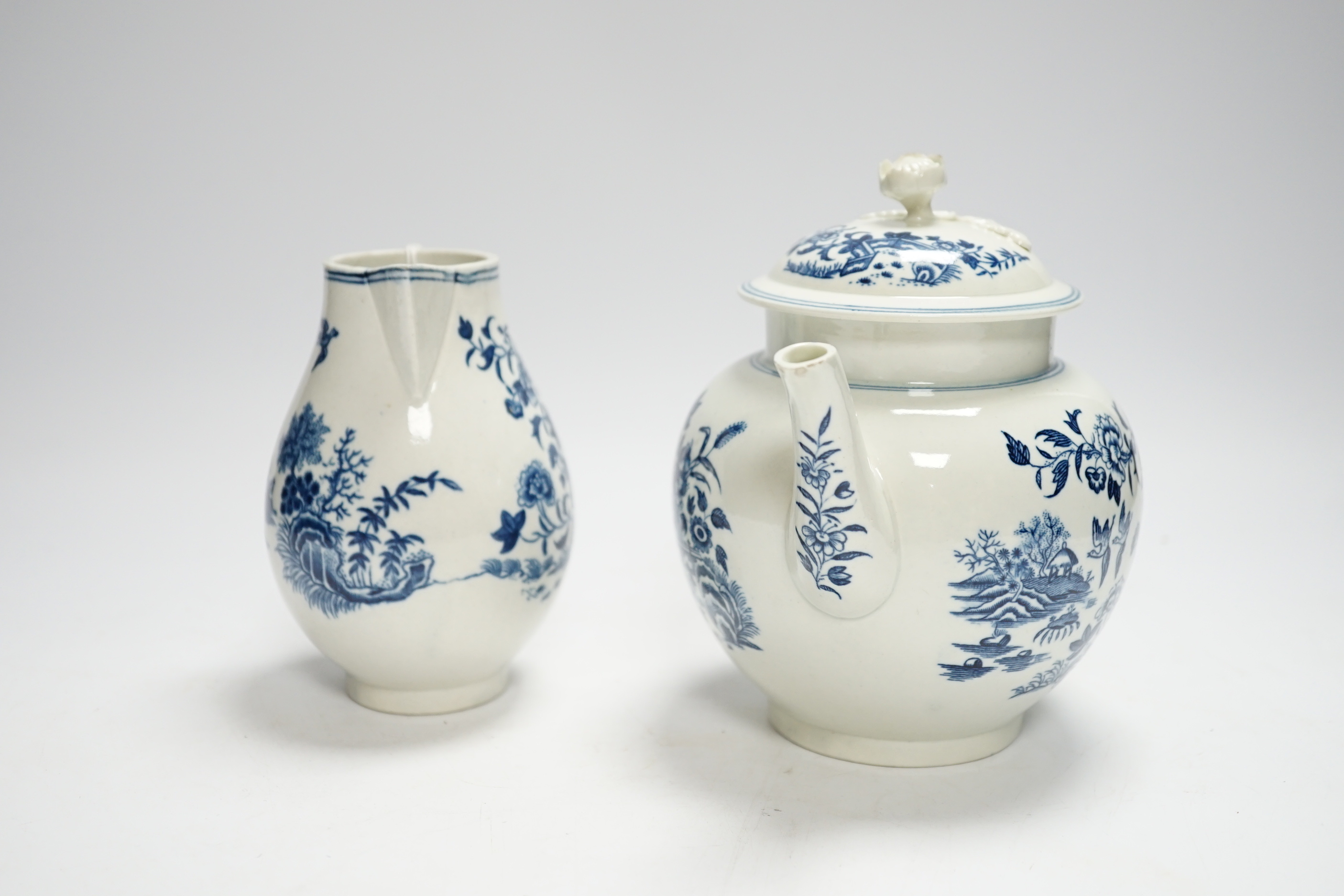 A Worcester fence pattern teapot and cover and a similar milk jug c.1775, largest 19cm wide